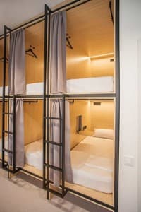 Capsule Hotel & Hostel. Номер Место в общем 8-местном номере Компания