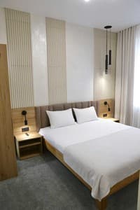 Hotels . Hotel Suite Quadruple with a double bed and single beds. 