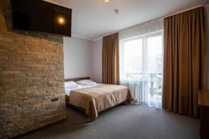 Готелі . Готель Сімейний тримісний люкс з балконом (3+1). 