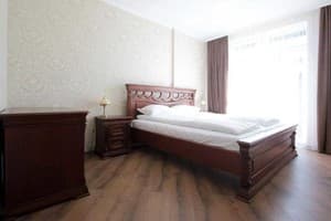 Old City Center Lviv. Room Suite Quadruple with a king-size bed